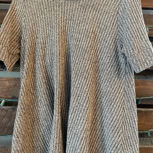 Brown flowy high-neck top.